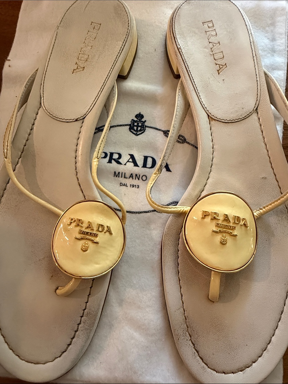 Prada Cream Leather Thong Sandals with Gold Logo Discs